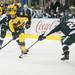 Wolverines right wing Zach Hyman skates past the Spartans right  defensemen Matt Grassi during the first period of their game at Yost Ice Arena Friday Feb. 1st.
Courtney Sacco I AnnArbor.com 